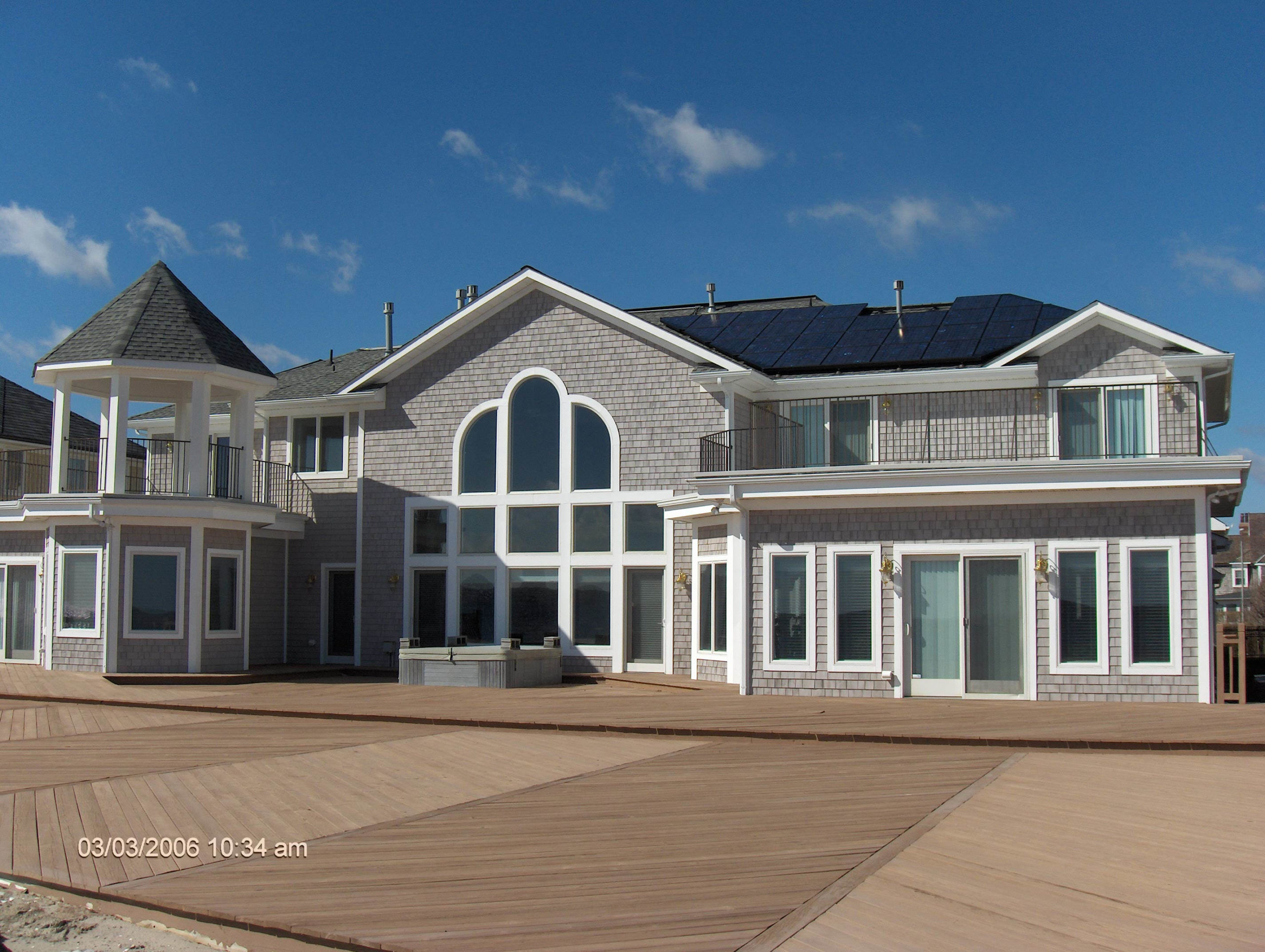 Home on boardwalk with solar panels