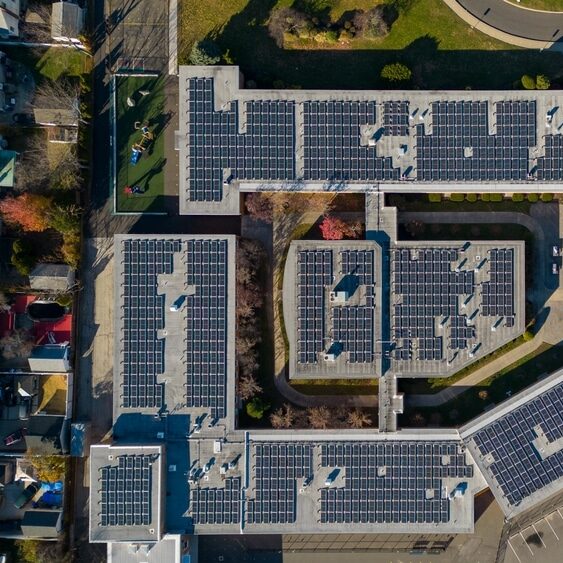 Solar panels on school building roof aerial view