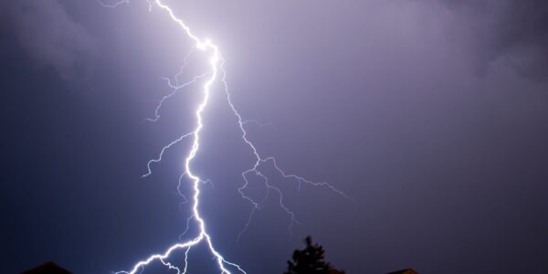 House With Lights On During A Thunderstorm