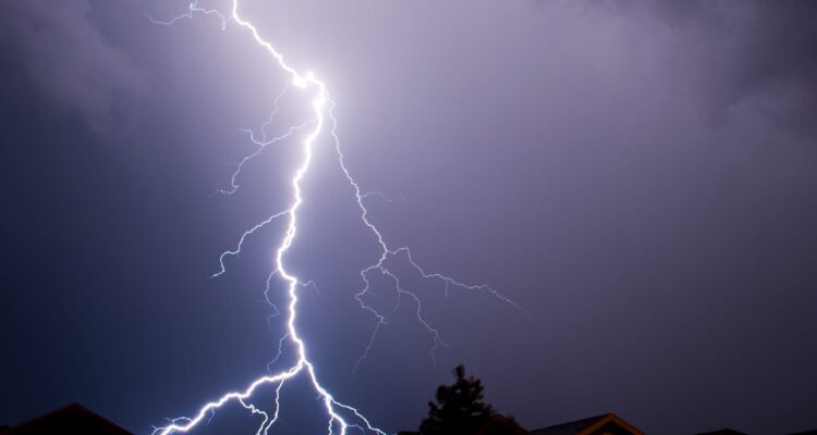 House With Lights On During A Thunderstorm