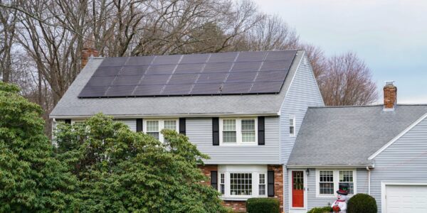 Rooftop Solar Panels Installed On Suburban Home