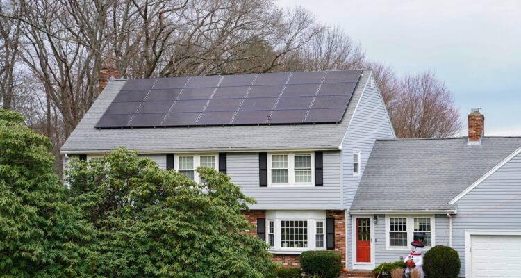 Rooftop Solar Panels Installed On Suburban Home